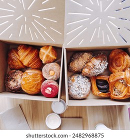 Two boxes of bread with dipping sauce