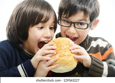 Two Boys Eating Bread