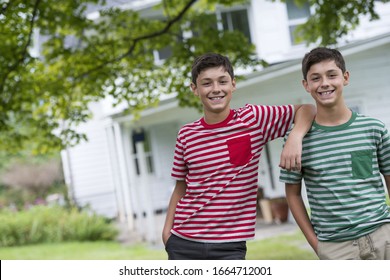 two-boys-f​armhouse-g​arden-summ​er-260nw-1​664712001