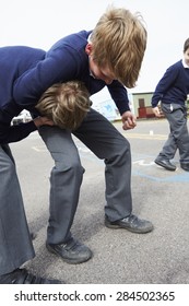 Two Boys Fighting In School Playground