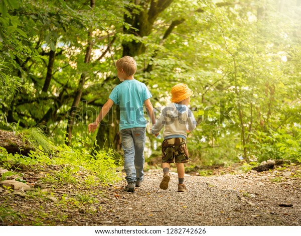 Two Boys Go Along Path Green Stock Photo (Edit Now) 1282742626