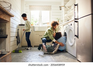 Two boys helping father with household chores