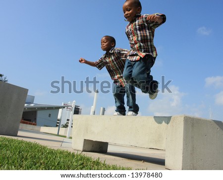 Two Boys Jumping from a Bench
