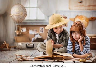 Two boys in the pilot study and the tourist old book travel - Shutterstock ID 334055645