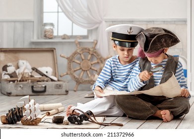 Two boys, a pirate captain, read travel map in her room - Powered by Shutterstock