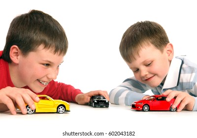 child playing with cars