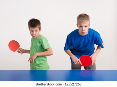 Two Boys Playing Table Tennis