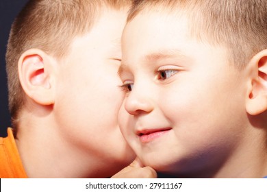 Two boys sharing secrets closeup portrait