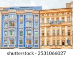 Two bright colorful buildings on Maria Theresa street in Innsbruck, Tyrol state, Austria