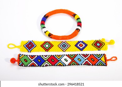 two brightly colored zulu wristbands with beaded armband