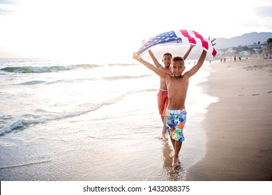 Two brothers honoring  the American flag - Powered by Shutterstock