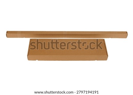 Two brown cardboard packaging boxes in different formats, including a long narrow shipping box and a flat rectangular mailer, isolated on a white background with ample copy space. Ideal for packaging, shipping, logistics, e-commerce, and product presentation concepts