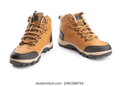 Two brown hiking boots with laces isolated on white. The boots are on a white background. The boots are made of leather and have a rugged appearance