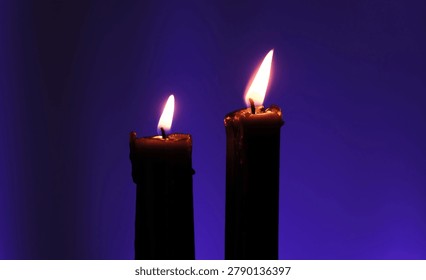 Two Burning Candles Flicker In The Wind