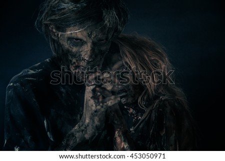 Two burnt zombie hug.