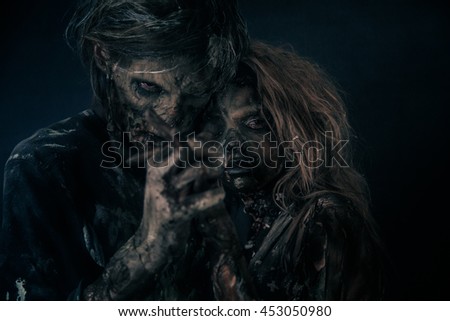 Two burnt zombie hug.