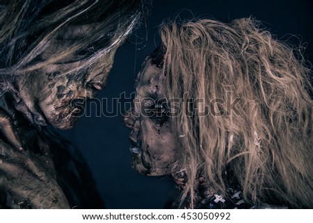 Two burnt zombie hug.