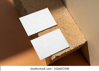 Two Business Card Mockup On The Orange Brick