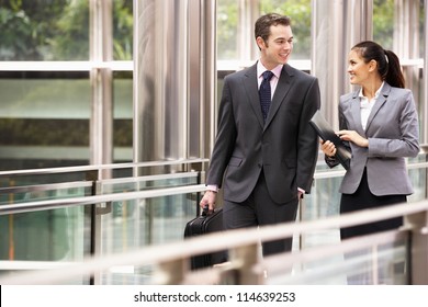 Two Business Colleagues Having Discussion Whilst Walking Outside Office