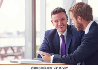 Two Business Colleagues In A Meeting, Close Up