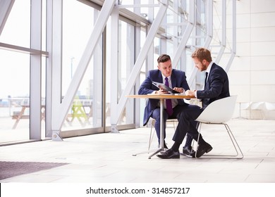 Two business colleagues at meeting in modern office interior
