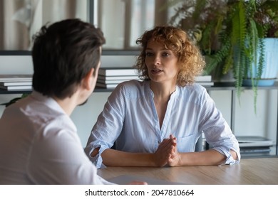 Two business coworkers, partners negotiating on project, deal. Serious recruit HR manager, employer interviewing job candidate on meeting in office. Female boss, leader instructing employee - Shutterstock ID 2047810664