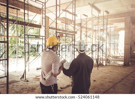 two business man construction site engineer, effect Vintage sun flare