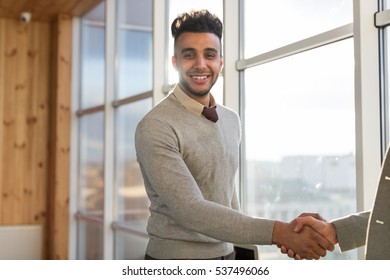 Two Business Man Shake Hand Agreement Coworking Center Business Team Coworkers Stand in front Big Panoramic Window Modern Office - Shutterstock ID 537496066