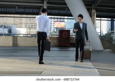 Two Business Man Walking Out Side In Office Modern Area In Middle Of The City 
