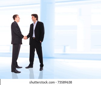 Two Business Men Shaking Hands At Corporate