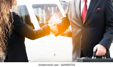 Two Business Men And Woman Shaking Hand To Appreciate Each Other About Aviation Business And Helicopter Platform Background, Close Up People Hands Shake Business Partnership Successful Outdoors, Deal 