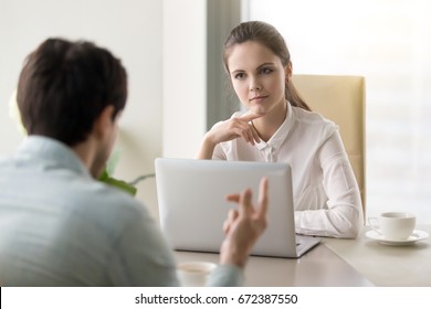 Two Business Partners Discussing New Project And Sharing Ideas, Young Serious Recruiter Woman Listening To Male Candidate During Job Interview, Female Manager Meeting With Client At The Office