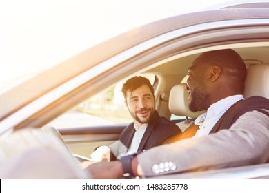 Two business people in the car make carpool into the office - Shutterstock ID 1483285778