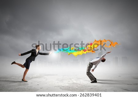 Two business people fighting with each other
