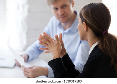 Two business people new employee and employer having dialogue. Man from human resource management interviewing lady, negotiation, recruiting, consulting, sale broker negotiating with client. Side view - Shutterstock ID 1339319183