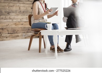 Two business people sitting in the chair discussing - Shutterstock ID 277525226