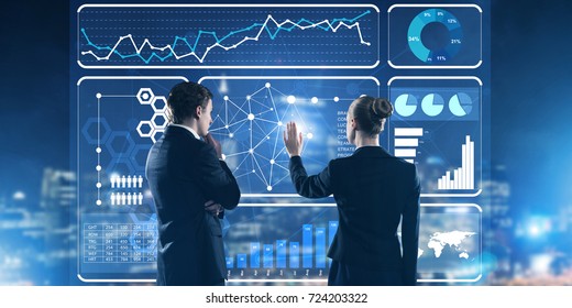 Two Business People Standing With Back And Working Together With Virtual Screen