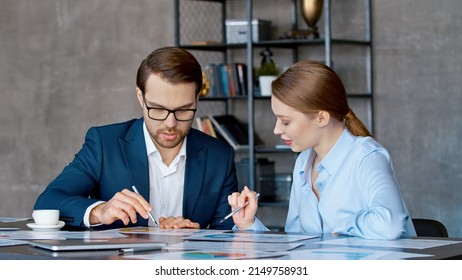 Two Business People Talk Project Strategy At Office Meeting Room