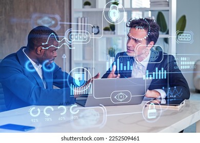 Two business people talking in office room with laptop on desk, double exposure with digital diagrams hud, big data protection and privacy. Concept of teamwork and research - Powered by Shutterstock