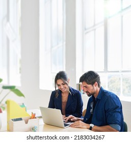 Two Business People Using Laptop Computer Colleagues Working In Office Sharing Ideas