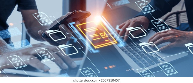 Two business people using smartphone and computer, document management system and business files storage, search and share. Concept of teamwork in electronic database - Powered by Shutterstock