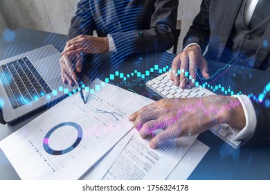 Two Business People Working Together On Stock Market Strategy. Try To Analyze Forex Behavior. Financial Graph Hologram. Double Exposure.