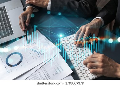 Two Business People Working Together On Stock Market Strategy. Try To Analyze Forex Behavior. Financial Graph Hologram. Double Exposure.