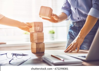 Two business persons plan a project. Team work in office. - Shutterstock ID 672298081