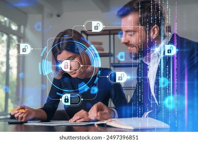 Two business professionals discussing cybersecurity with digital locks and binary code overlay in an office, symbolizing data protection and technology - Powered by Shutterstock