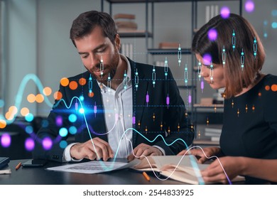 Two business professionals reviewing documents with digital financial graphs overlay. Office background. Concept of finance and data analysis - Powered by Shutterstock