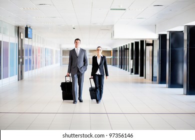 two business travellers walking in airport - Powered by Shutterstock