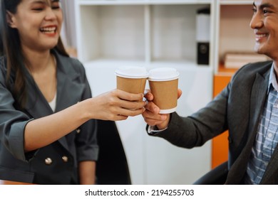 Two Business Worker Standing And Holding A Coffee Cup In Modern Office, Successful, Celebration, New Project, Team Office Concept In Morning 
