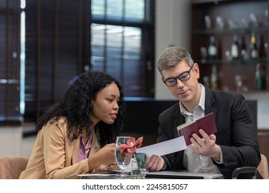 Two business workers are waiting and taking facility service at an exclusive airline lounge. Travelers get refreshment at a private lobby to be ready for their trip. - Shutterstock ID 2245815057