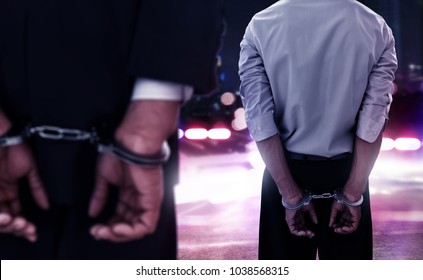 Two Businessman In Handcuffs